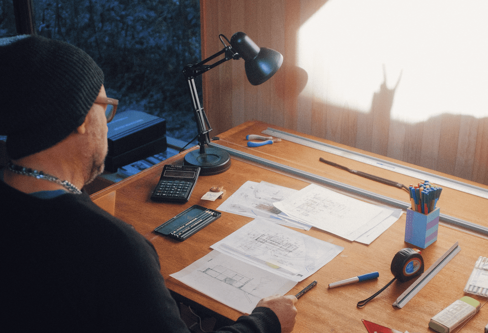 Company Investments - Man At Desk